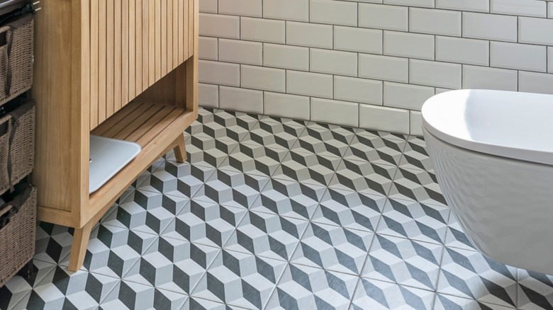 Modern bathroom with large, three-dimensional floor tiles