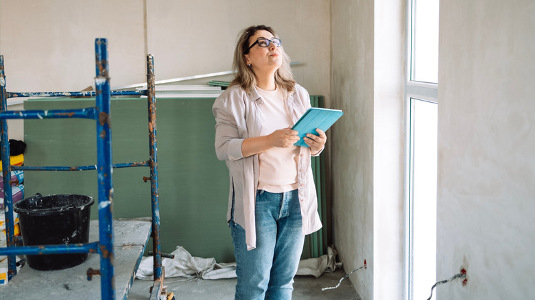 A designer looking up at the ceiling