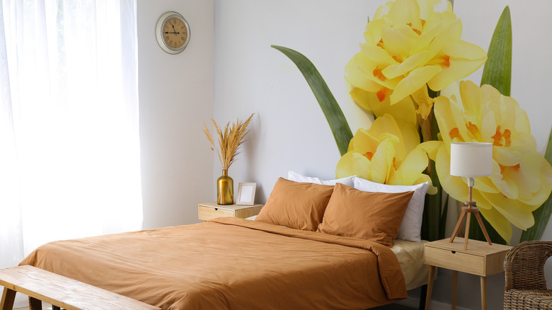 floral wall mural over bed