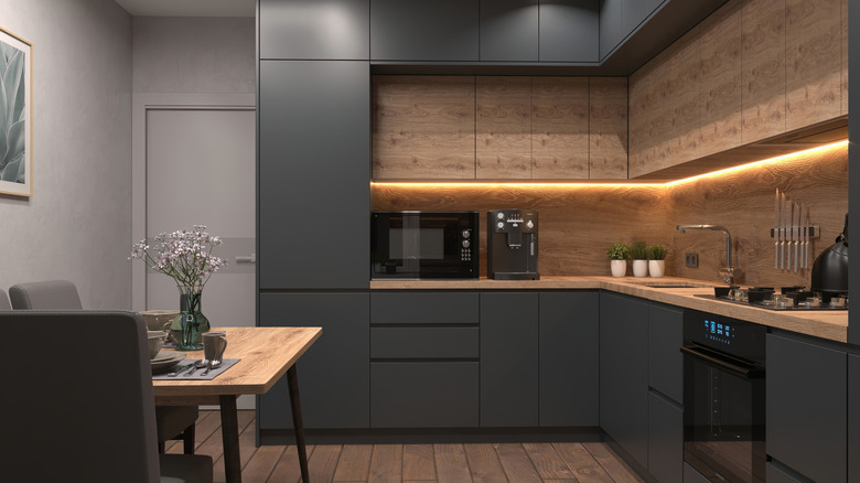 Minimalist kitchen with wood backplash