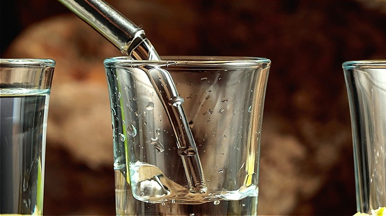 Tequila being poured in glass