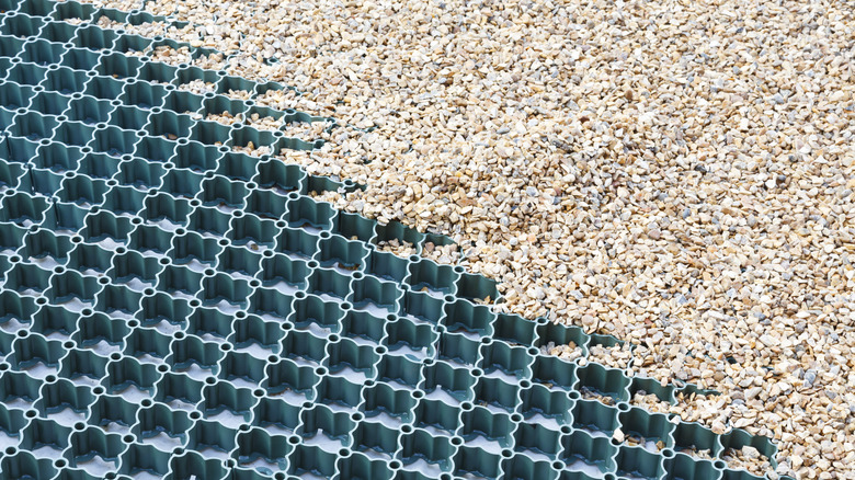 Gravel being added to a grid system