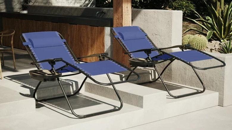 Two zero-gravity chairs reclined outside