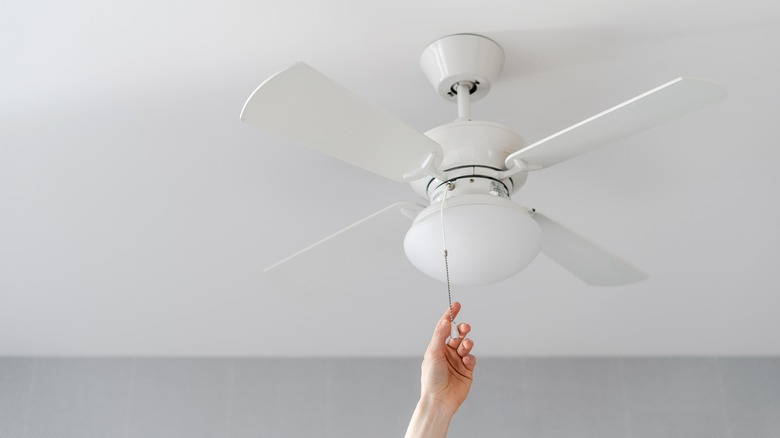 Hand activating ceiling fan