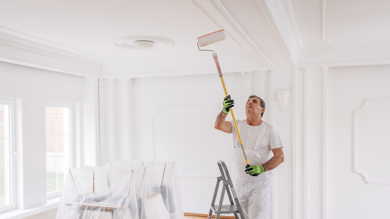 Person painting ceiling