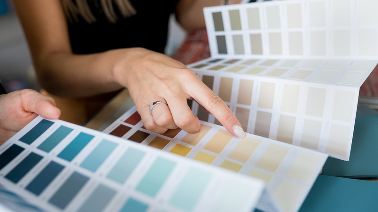 Person choosing paint color