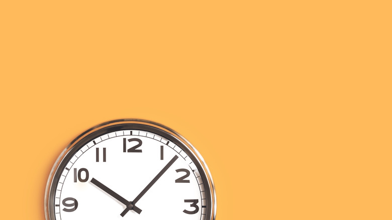 clock on yellow background