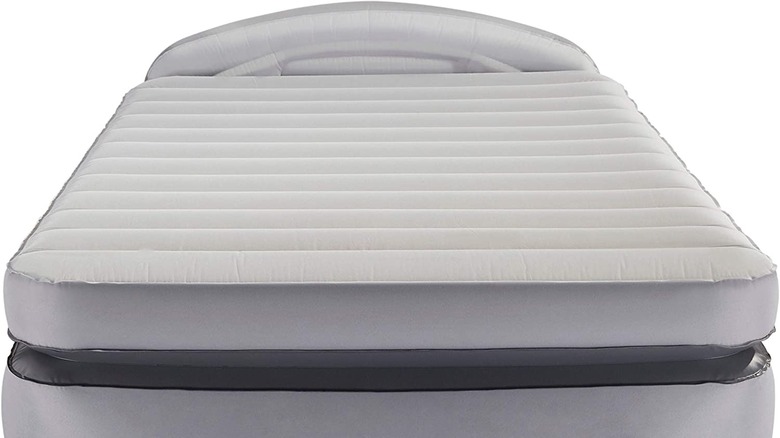 gray air mattress in room