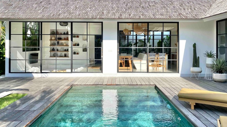 pool with view of modern home