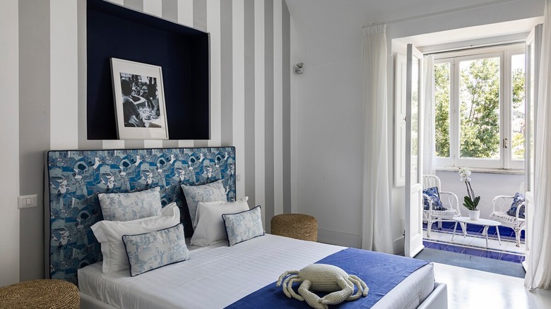 stylish bedroom with blue bed