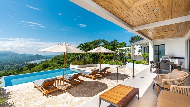 patio with pool and ocean view