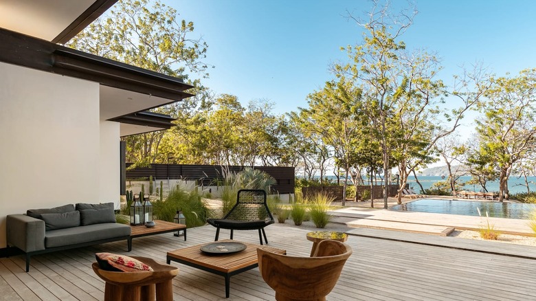 patio with pool and ocean view