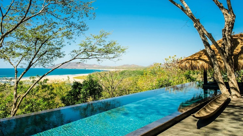 infinity pool with beach view