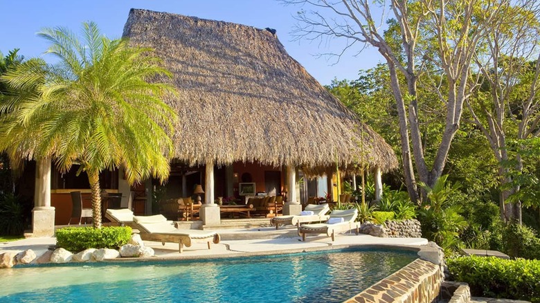 hut style villa with pool