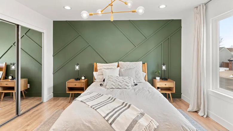 bedroom with green accent wall