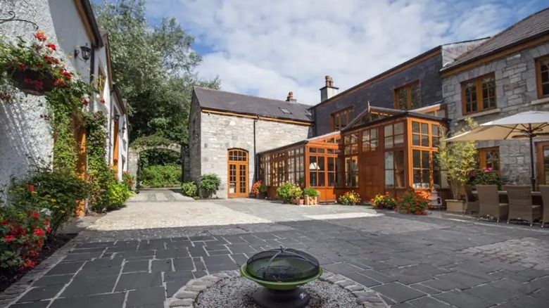 Stone buildings around stone patio