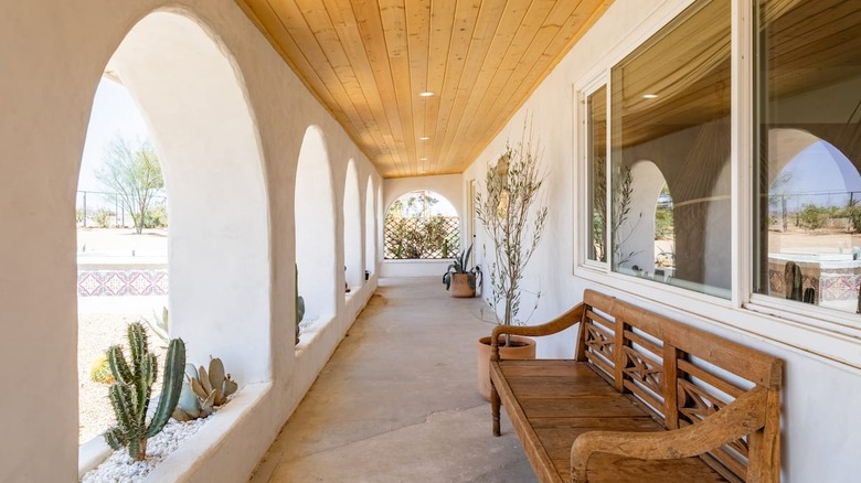 white arches and brown bench