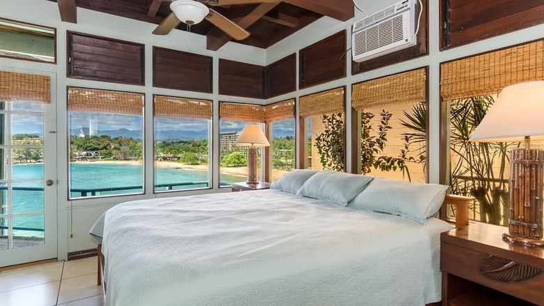 white bed with ocean view 