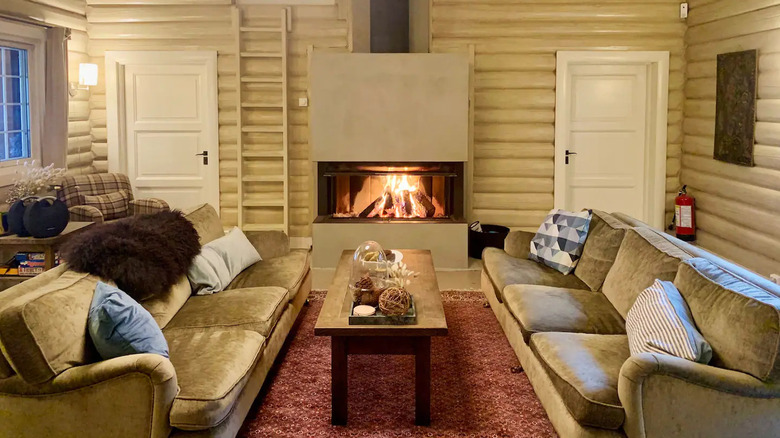 A cream-colored living room with a fireplace