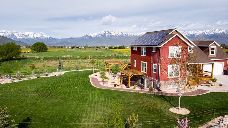 red barn with mountains 