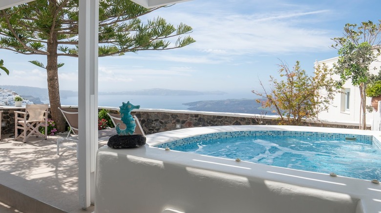 hot tub on patio overlooking ocean