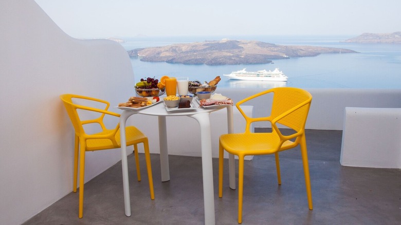 patio table with yellow chairs