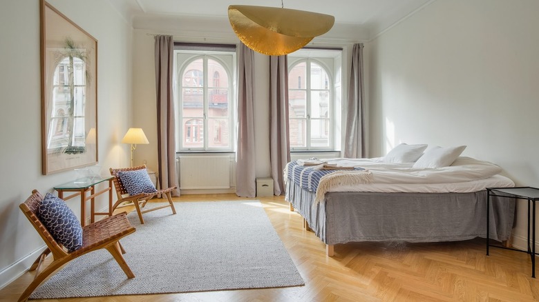 bedroom with cool light fixture