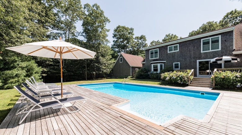 outdoor pool deck with lounge chairs