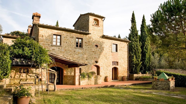 exterior of tan stone Tuscan villa 