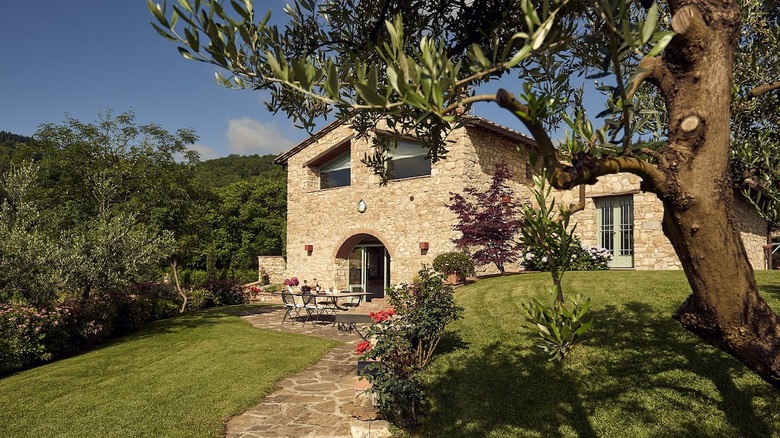 stone Italian villa with table  