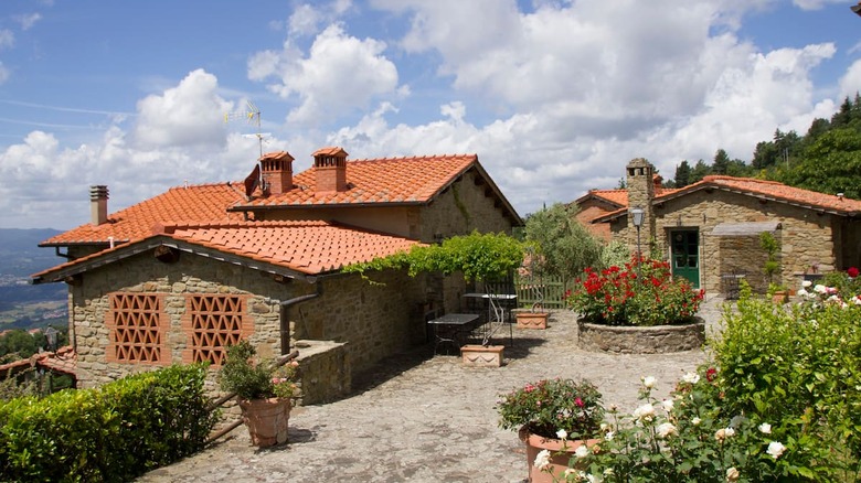 stone villa with rose garden 