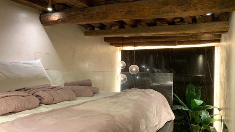 italian bedroom with exposed beams