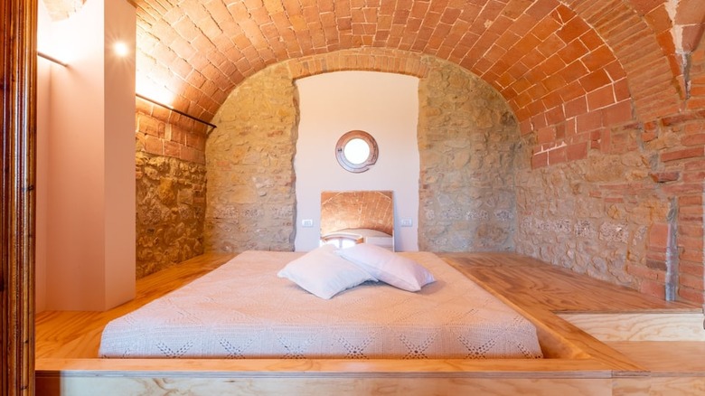 bed in a stone bedroom