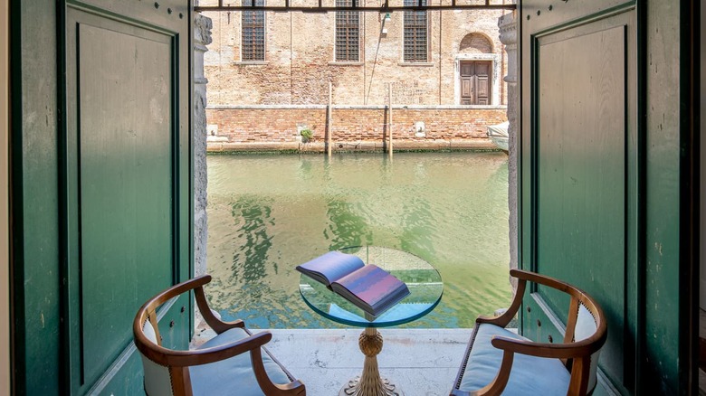 table and chairs overlooking canal