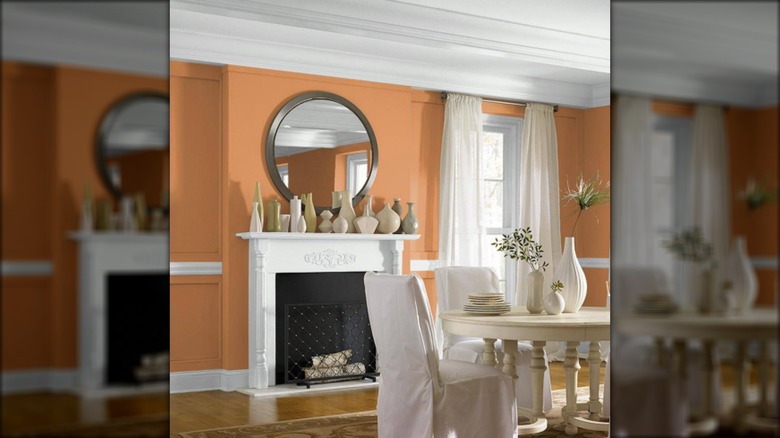 dining room with orange wall