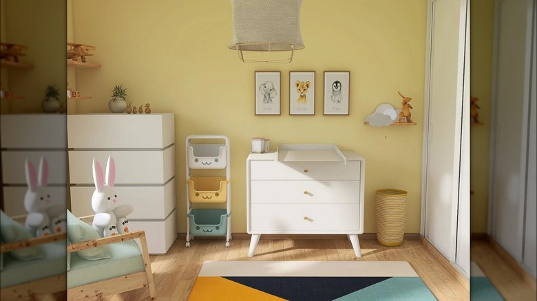 nursery with yellow accent wall