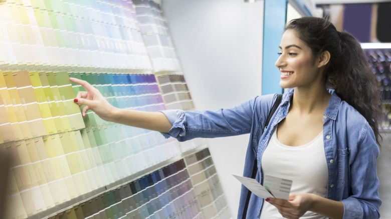 woman looking at paint swatches