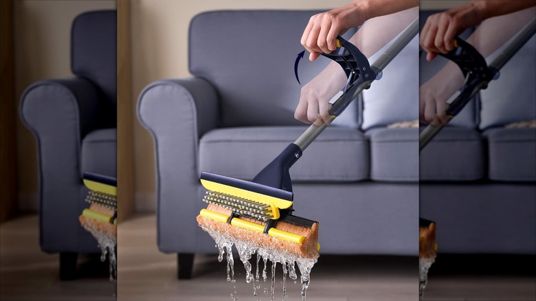 Squeezing water out of sponge mop