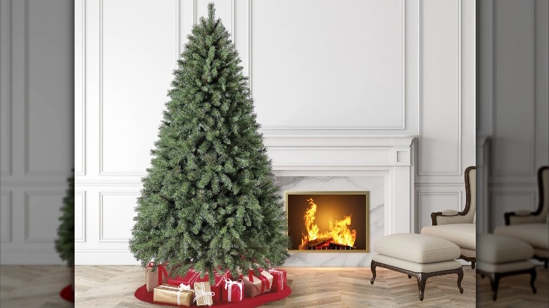 full tree next to fireplace