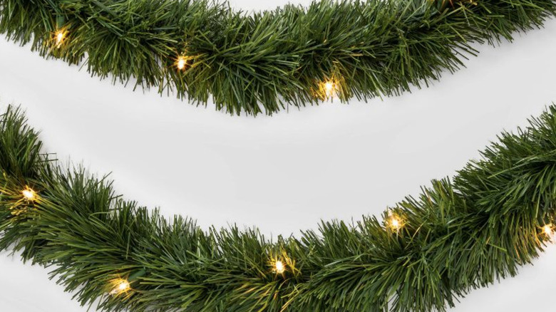 green pine garland with lights