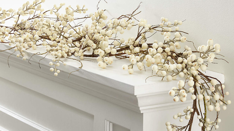 white berry garland on mantel