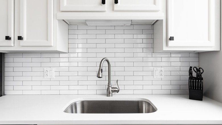 white brick kitchen backsplash