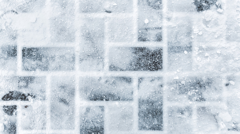 Overhead shot of a stone patio covered in snow and ice