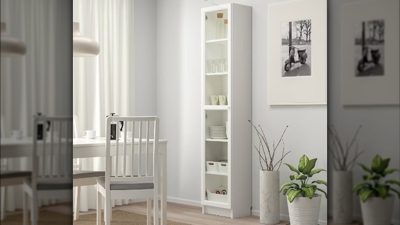 white bookcase with glass door