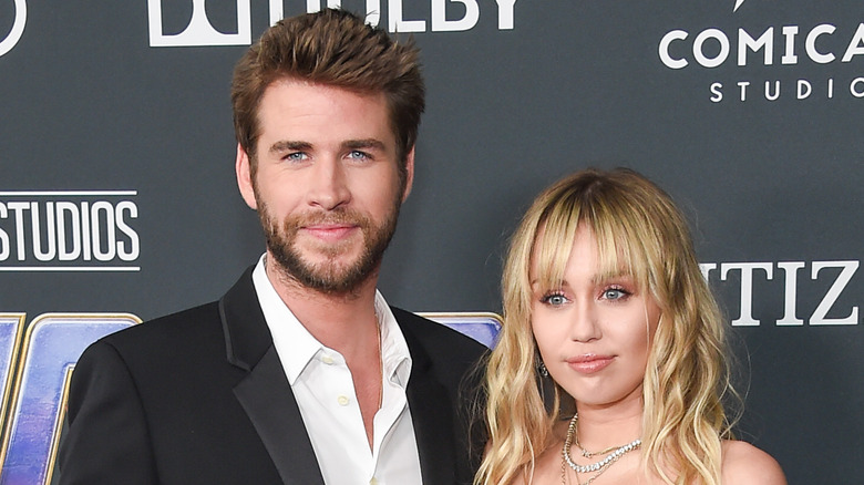 Miley Cyrus and Liam Hemsworth black dress