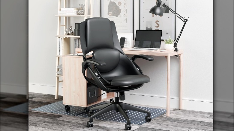 black office chair at white desk