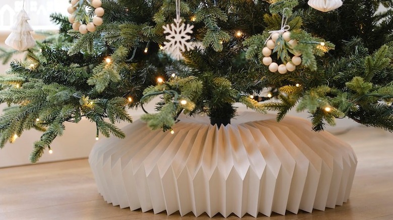 White paper folded tree collar