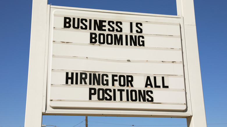 business is booming sign