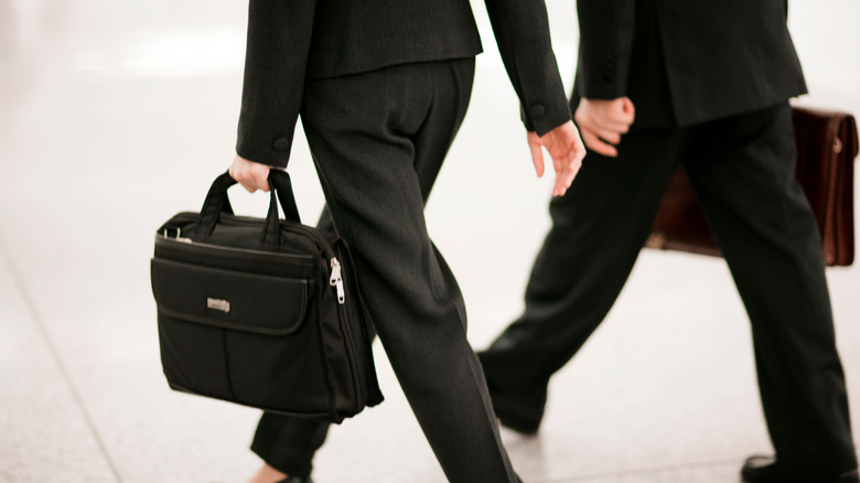 suited professionals striding