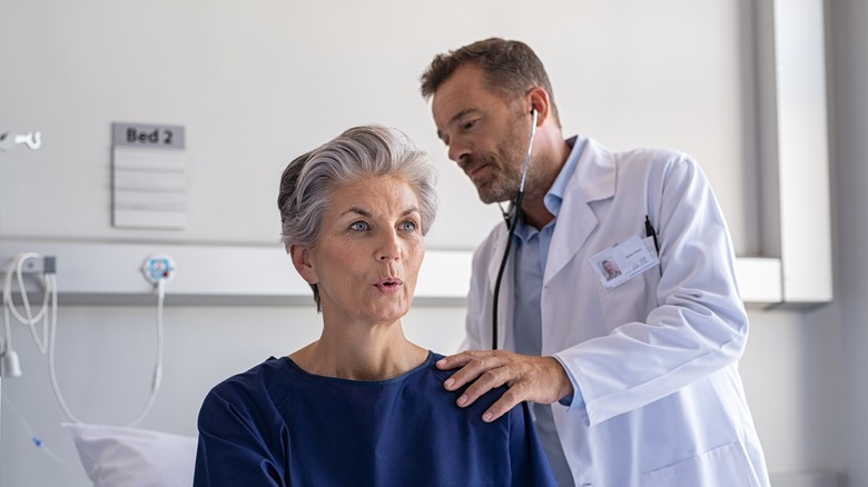 doctor assisting patient 